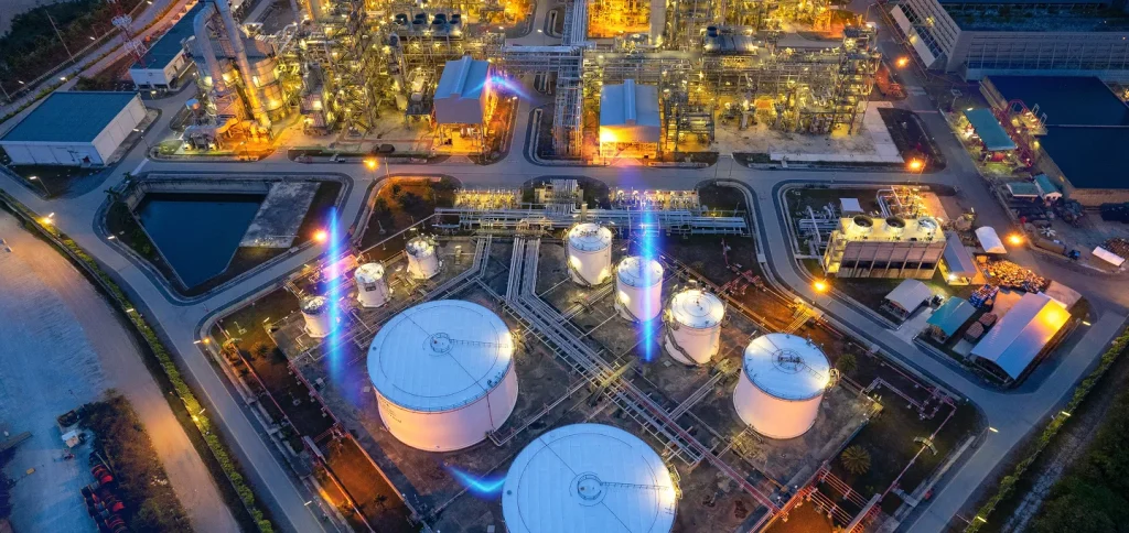 Aeral view of a power plant with blue hallow illustrating the use of digital twin technology